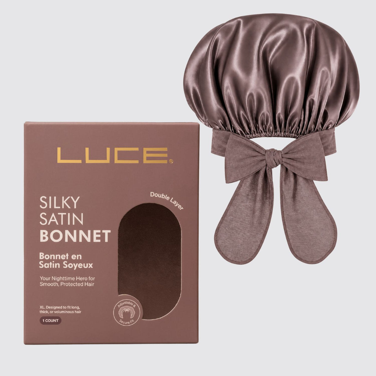 Brown satin bonnet with bow and LUCE packaging on a light gray background