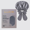 Gray satin bonnet with packaging labeled 'LUCE' on a light gray background